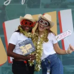 Two guests using a South Florida photo booth rental at an event