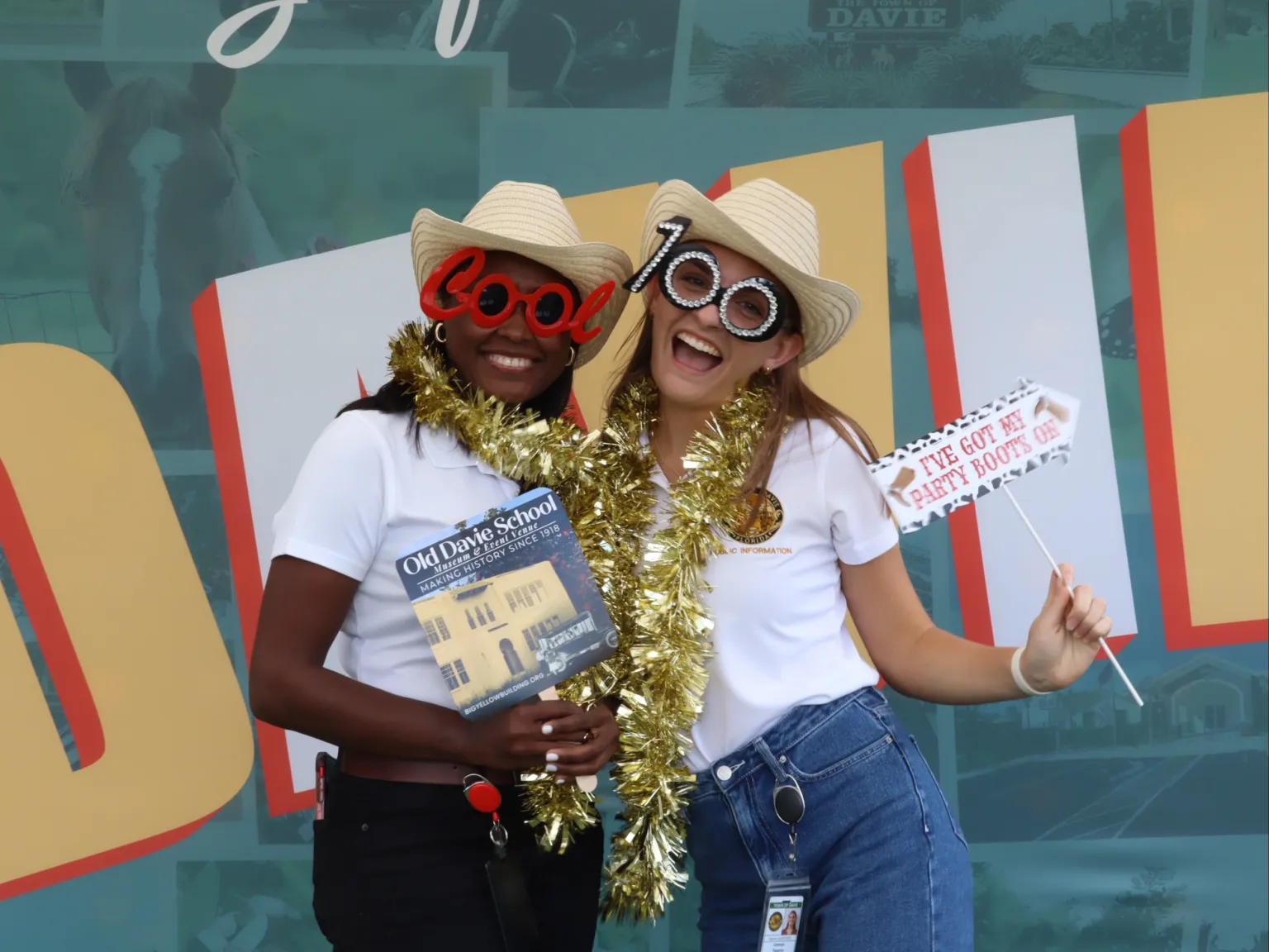 A photo of two woman using the photo booth.