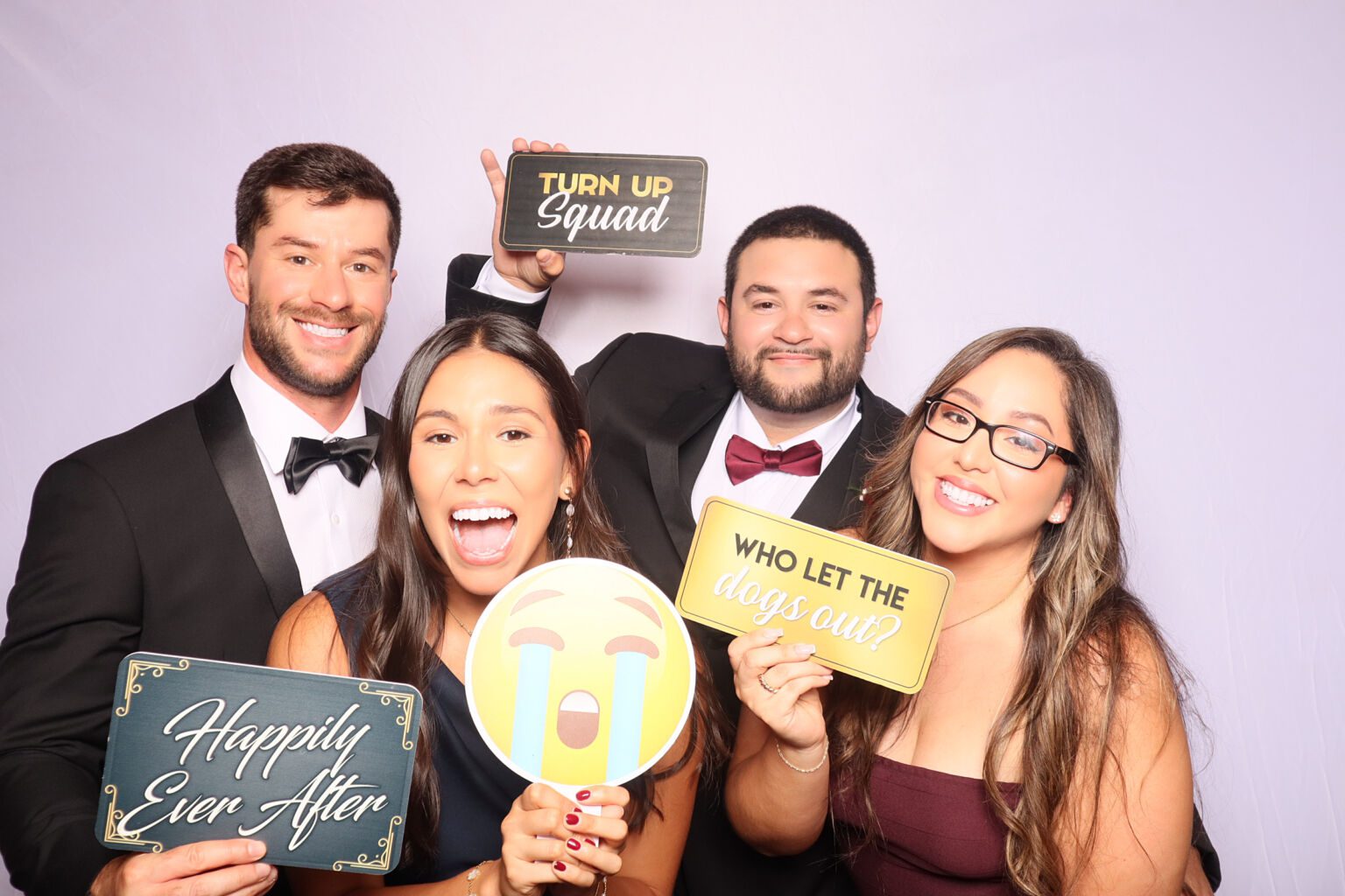 Family taking a photo with props at the photo booth