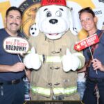 Firefighters taking photo at photo booth
