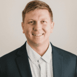 Woman taking a photo using the headshot photo booth