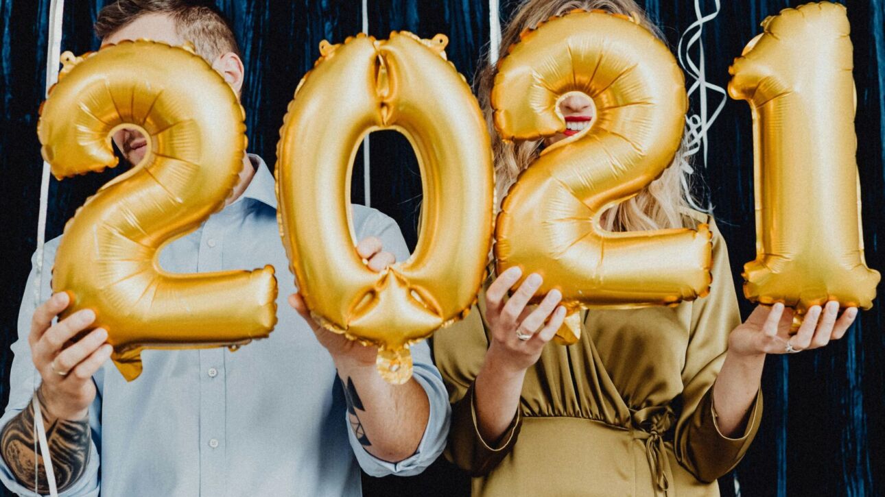 Guests holding balloons in front of a Motion photo booth in Fort Lauderdale