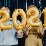 Guests holding balloons in front of a Motion photo booth in Fort Lauderdale