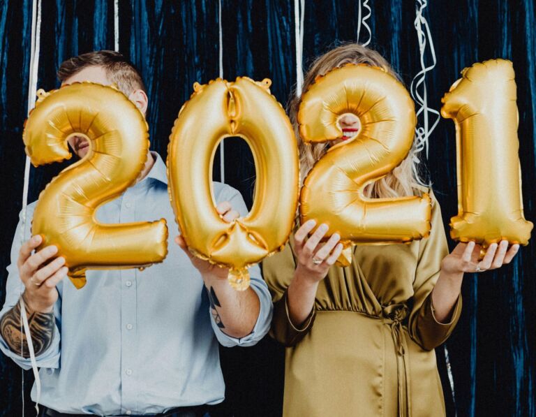 Guests holding balloons in front of a Motion photo booth in Fort Lauderdale