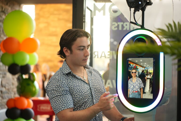 Second picture of Thomas Steckman next to a photo booth.