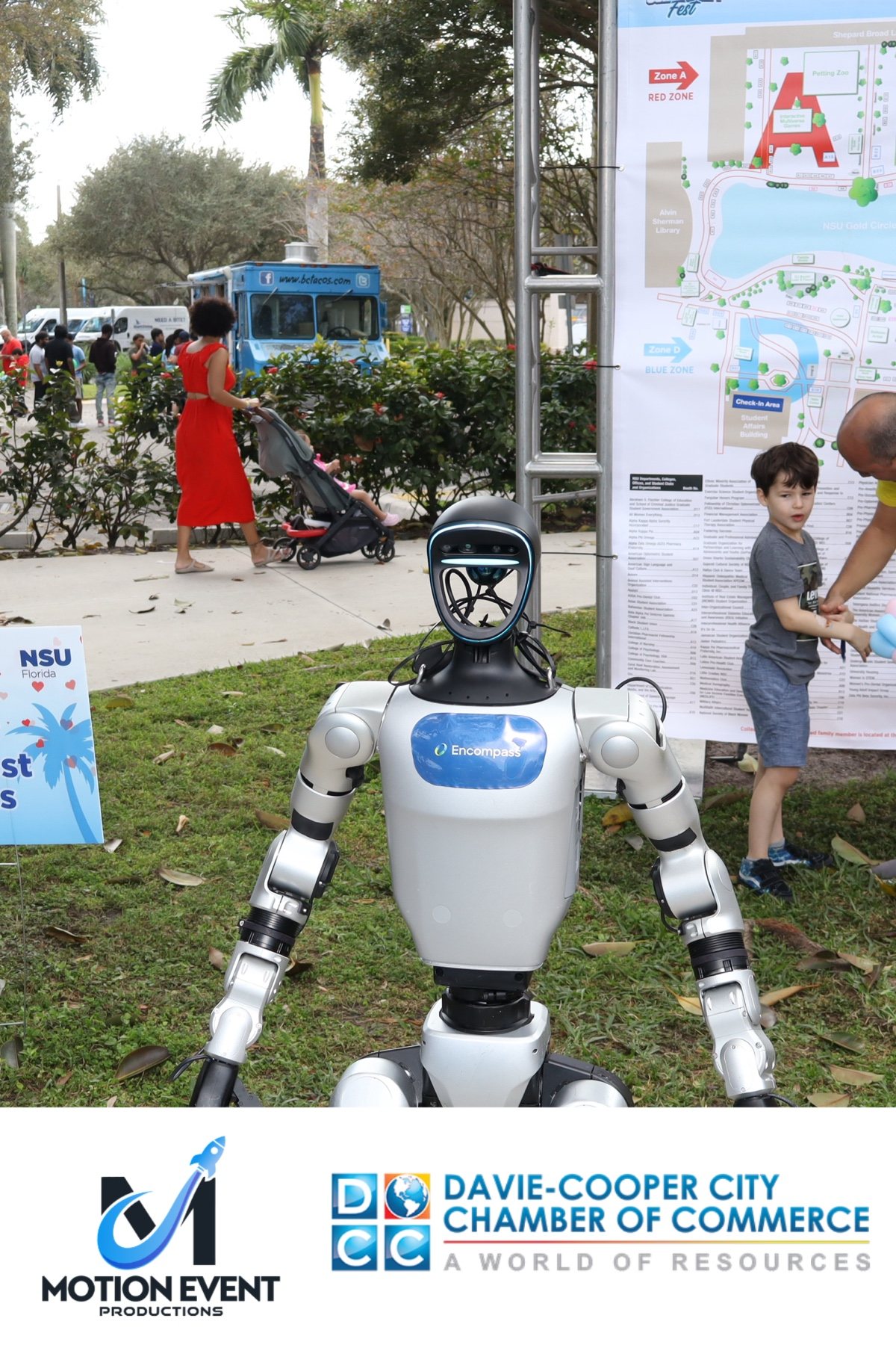 Robot mascot photographed at a Motion photo booth during a Davie-Cooper City Chamber of Commerce event