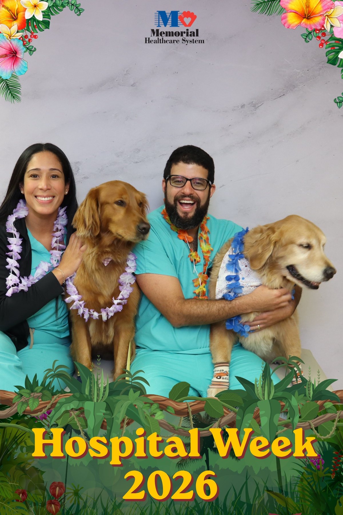 Three hospital staff with therapy dogs at a Hospital Week photo booth