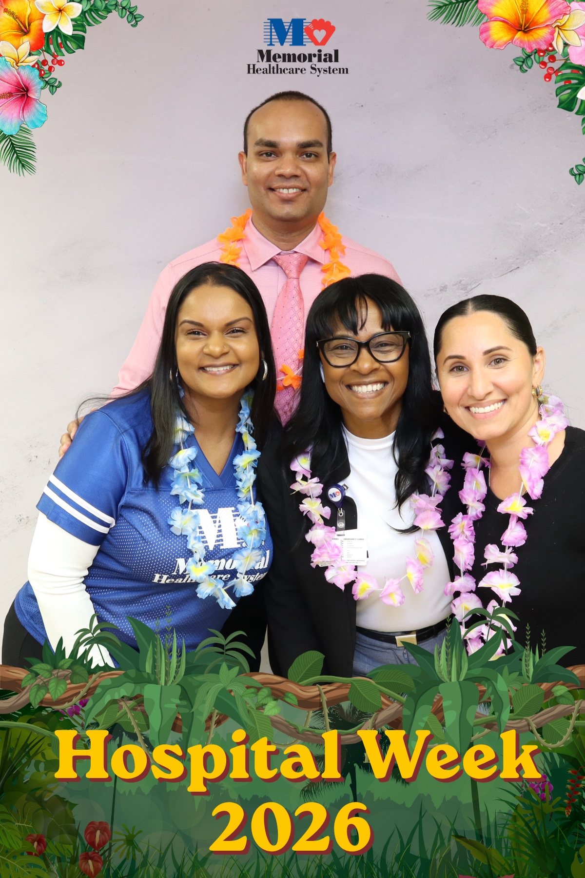 Four hospital staff in leis posing together at a Hospital Week photo booth