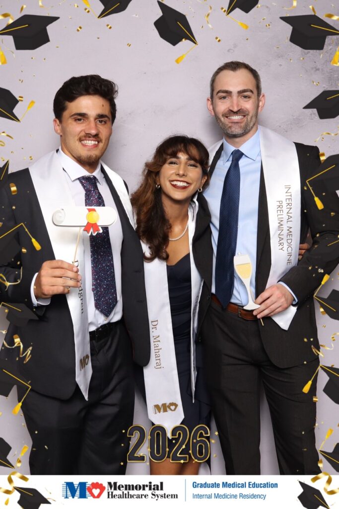 Group of graduates and family at a medical residency graduation photo booth